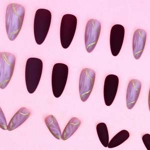 Matte wine red almond press-on nails with lavender marble and gold wave line designs