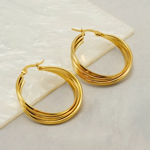 Polished gold triple layered hoop earrings with minimalist stack design for women