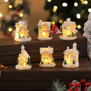 Detail of 6 piece light up white resin Christmas village houses with warm LED glow