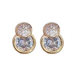 Elegant gold double circle stud earrings featuring cubic zirconia pavé and bezel set stones