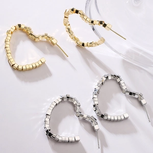 Minimalist geometric heart hoop earrings in gold and silver finish with textured cubes
