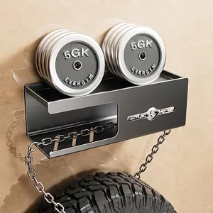 Wall-mounted black metal bathroom shelf showing heavy load capacity with dumbbells