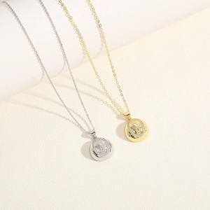 Golden and silver oval religious pendants with colorful zircon inlay on thin chains