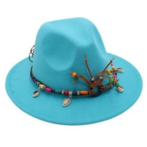 Detail of turquoise fedora with leather band, wooden beads and hanging seashell charm