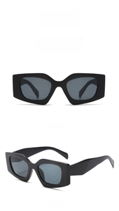 Front and side views of children's sand black geometric sunglasses with gray lenses