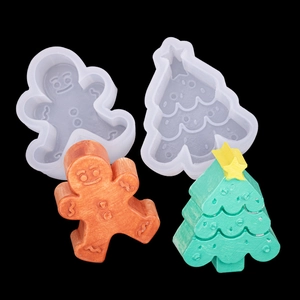 Detail showing silicone molds and finished gingerbread man and Christmas tree crafts