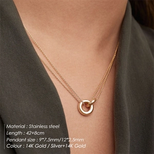 Two-tone stainless steel double circle necklace worn by a model on 14K gold chain