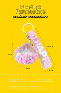 Detailed view of pink shell keychain with liquid sequins and HAPPY printed wrist strap