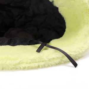 Plush neon green faux fur bucket hat with warm black quilted lining and adjustable strap
