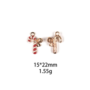 Detail of red and white enamel candy cane pendant with rhinestone bow and dimensions