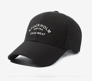 Detail view of black cotton baseball cap with Stockholm Sweden embroidery from 45-degree angle