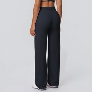Rear view of high waisted flared yoga pants in solid black with double-sided brushed fabric
