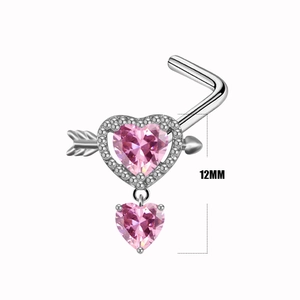 Macro detail of silver L-shaped nose stud with pink heart and arrow pendant in 12mm size