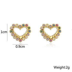 Macro shot of 18K gold plated heart stud earrings with multi-color cubic zirconia stones
