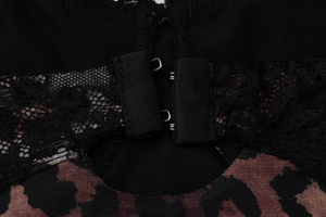 Detail view of lace splicing and leopard print mesh with metal double-row buckle on dress