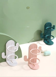Detail showing high-quality PP plastic material of cactus toothbrush holder in green and white