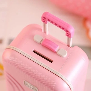Pink suitcase shaped money box bank for travel themed DIY home storage with coin slot