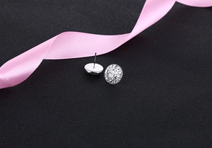 Macro shot of S925 silver crystal stud earrings with micro-pave rhinestones on black