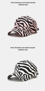Detail of zebra print cotton baseball caps in pink and white color options