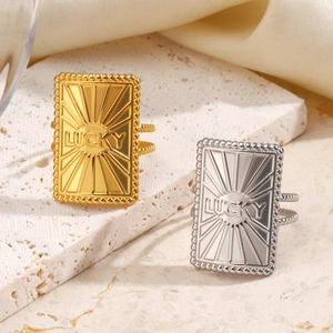 LUCKY engraved rectangular stainless steel rings in gold and silver with beaded bands