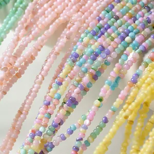Macro shot of colorful irregular shell beads in macaron shades for DIY jewelry making
