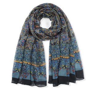 Bohemian paisley printed scarf in lake blue with ethnic patterns and black border trim