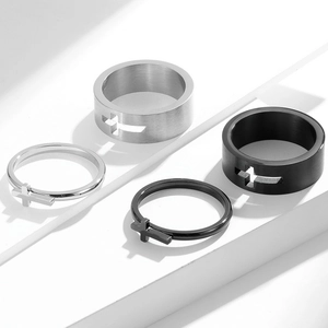 Set of stainless steel cross rings in silver and black finishes with hollowed designs