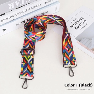 Detail of adjustable wide bag strap with colorful geometric pattern and metal hooks