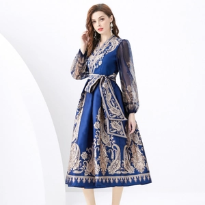 Navy blue V-neck maxi dress with golden paisley print and sheer lantern sleeves