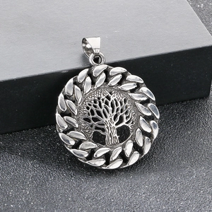 Detailed macro view of silver stainless steel Yggdrasil tree of life pendant on black box