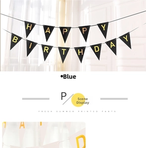 Detail of Happy Birthday triangle bunting banner with gold foil letters on black pennants