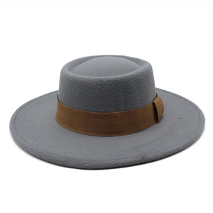 Close-up of gray wool felt boater hat with a wide dark brown decorative fabric band