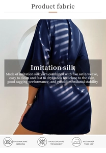 Detail of silk-like satin robe fabric with luxury sheen and smooth drape texture