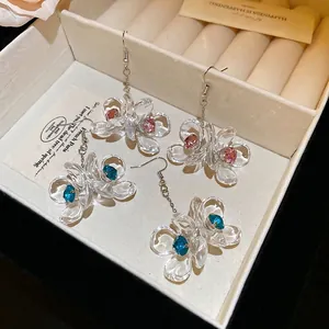 Vintage acrylic flower drop earrings with crystals in a velvet jewelry box display