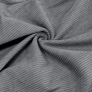 Detailed macro view of grey corduroy fabric texture and vertical ribbed pattern