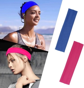 Detail showing elastic sports headbands in navy blue and rose red for yoga and fitness