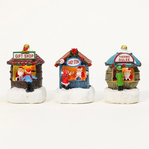 Trois maisons de Noël lumineuses en résine comprenant des magasins de cadeaux et bonbons
