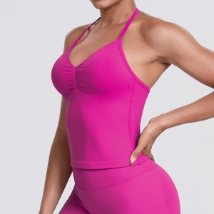 Detail of rose red seamless yoga set featuring V-neck sports bra and high-waist leggings