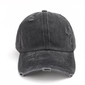 Close-up of distressed charcoal grey washed cotton baseball cap with vintage torn details