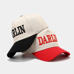 Retro trucker hat featuring DARLIN embroidery and two-tone color block baseball cap design