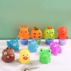 Assorted colorful soft rubber squeeze toys featuring pumpkin, monster, and animal shapes