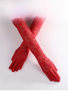 Close-up of red lace gloves with intricate floral patterns and elbow-length design