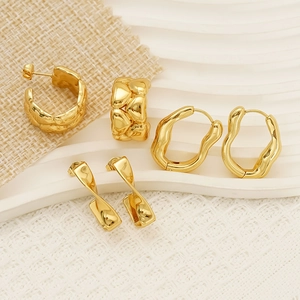 Three pairs of irregular gold titanium steel earrings in heart and fluid twist designs