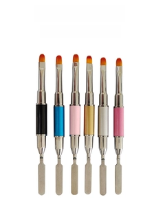 Close-up of dual-ended metal nail art spatula with brush and color mixing tool set