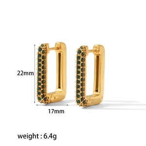 Detailed view of 18k gold plated rectangular earrings with green cubic zirconia crystals