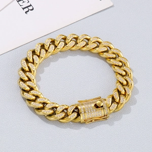 Macro shot of gold-plated Cuban link bracelet featuring micro-pave clear cubic zirconia