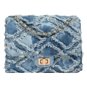 Blue denim crossbody bag with diamond quilting, fringe details and golden chain strap
