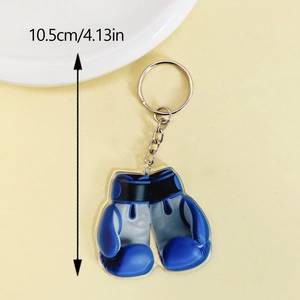 Detail shot of acrylic blue boxing gloves keychain with size label 10.5cm and metal ring