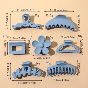 Set of 7 matte blue claw clips in various styles with precise size and weight markers