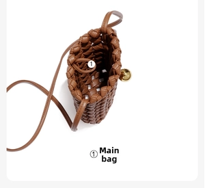 Detail view of woven leather mini crossbody bag interior with gold sphere clasp